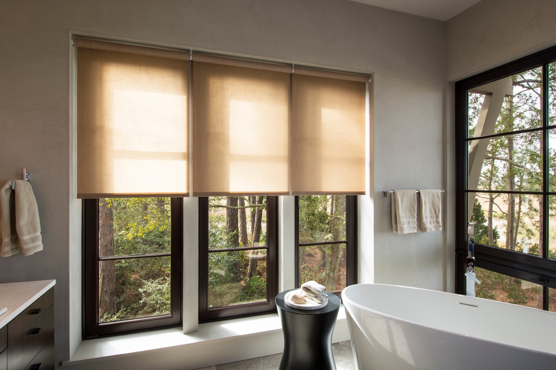 Recessed motorized shades integrated into a luxury window opening