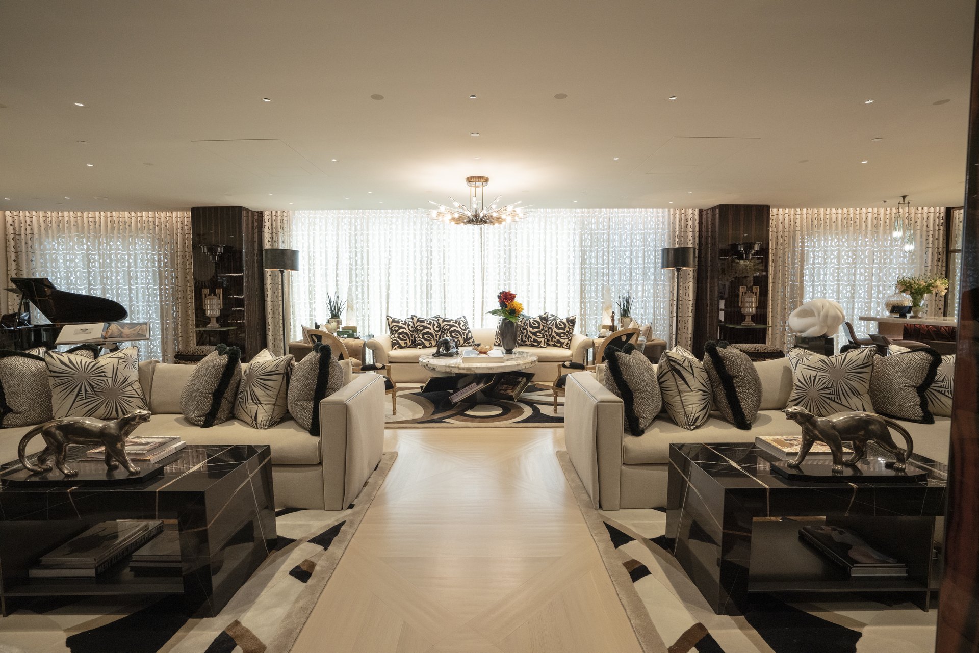 Formal living room with grand piano and small aperture ceiling speakers