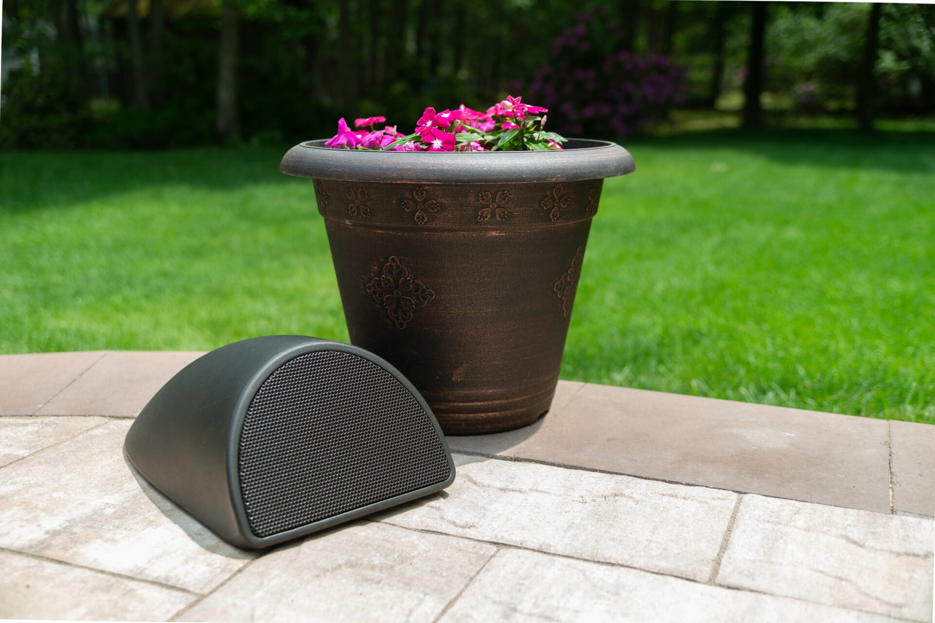 Outdoor landscape speaker integrated into patio planting