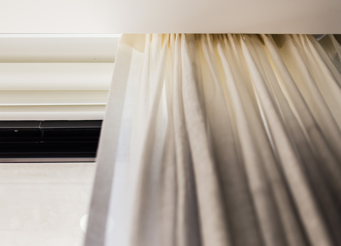 Concealed motorized drapery track detail for automated window treatments