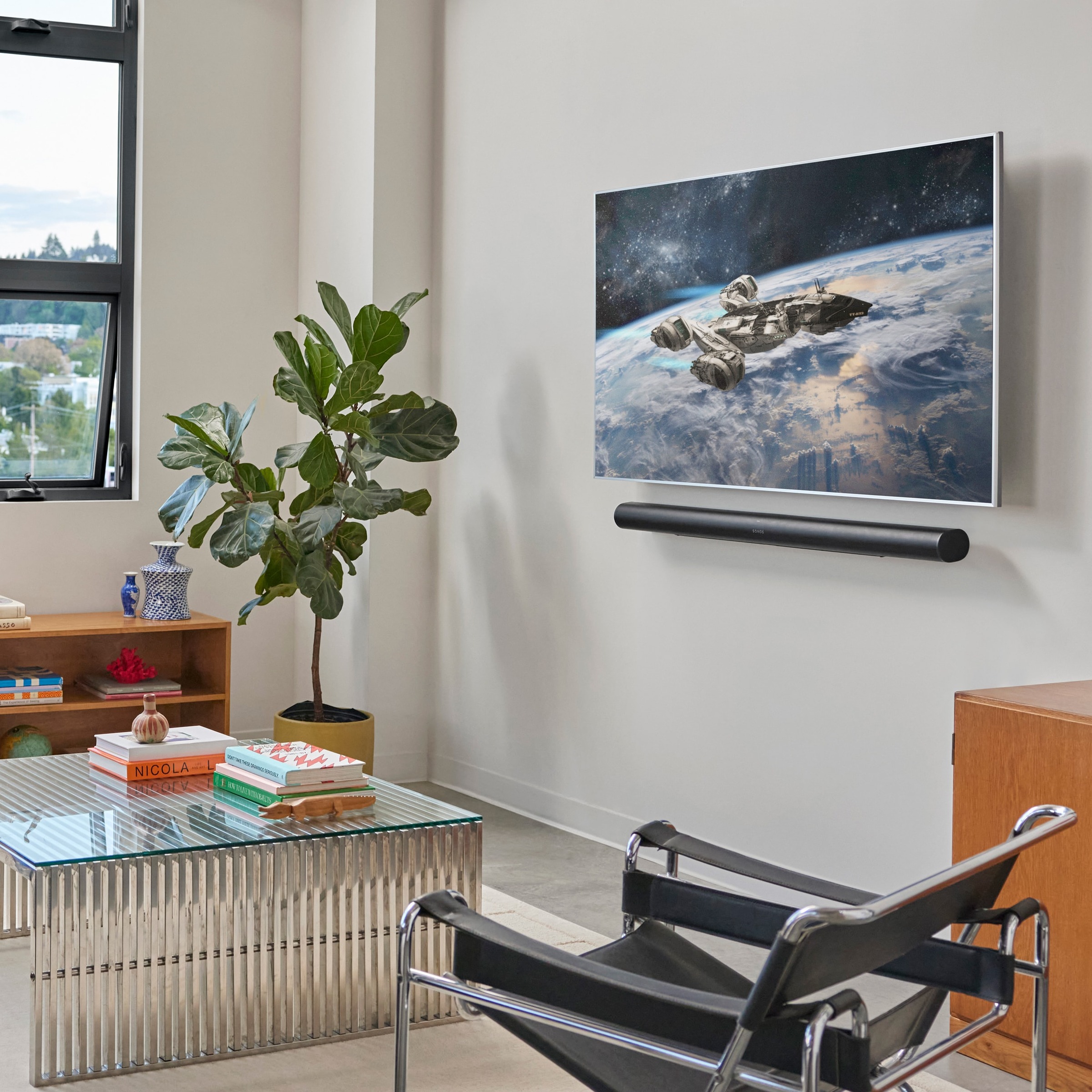 Sonos Arc Ultra wall-mounted beneath a television in a living room