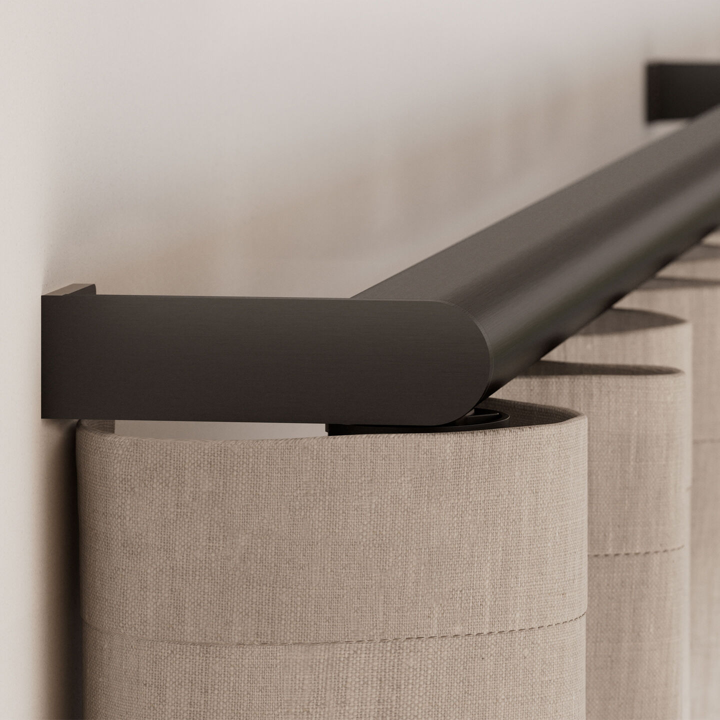 Close-up of a Palladiom drapery track end bracket and fabric return
