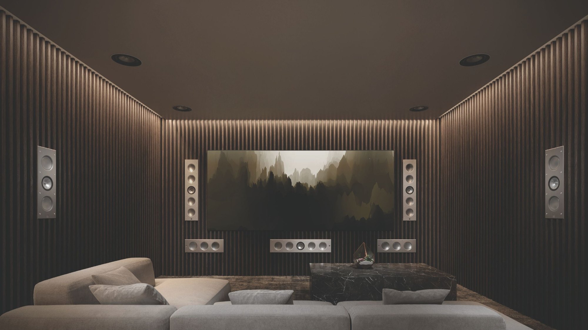 Home theater with slatted walls and in-wall speakers