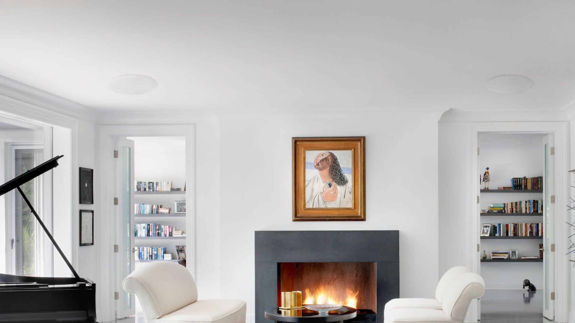 Bright living room with in-ceiling speakers