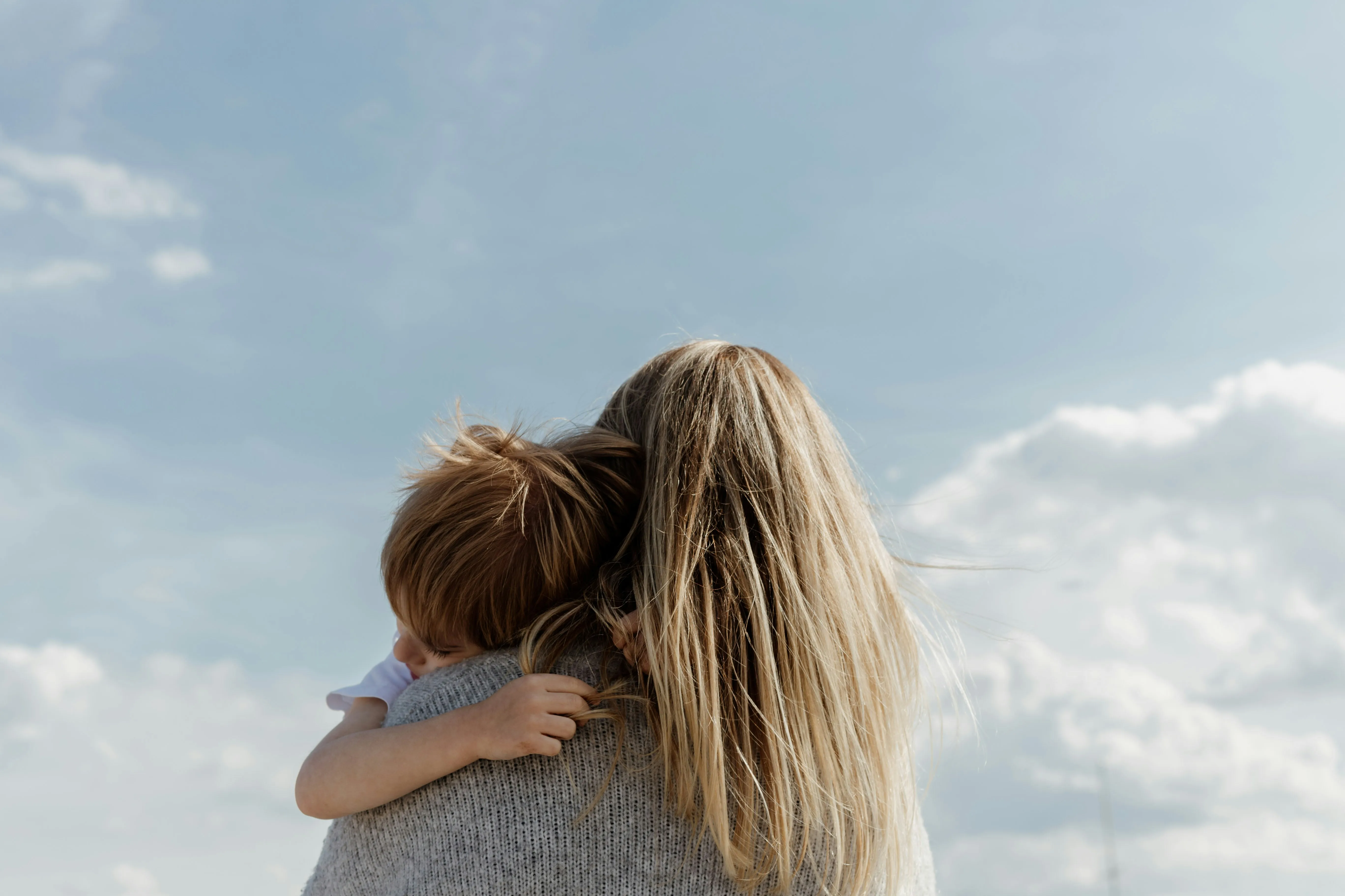 A woman hugging her child