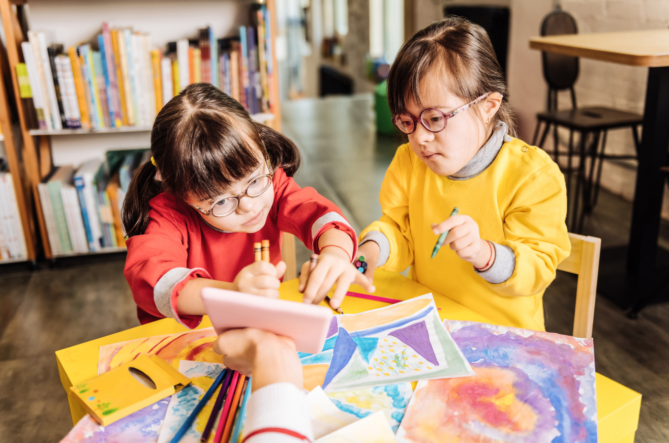 Two disabled children drawing together