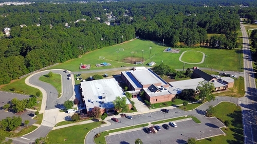 Birdseye view of Washington & Henry Elementary school with large green field in the background; where we train.