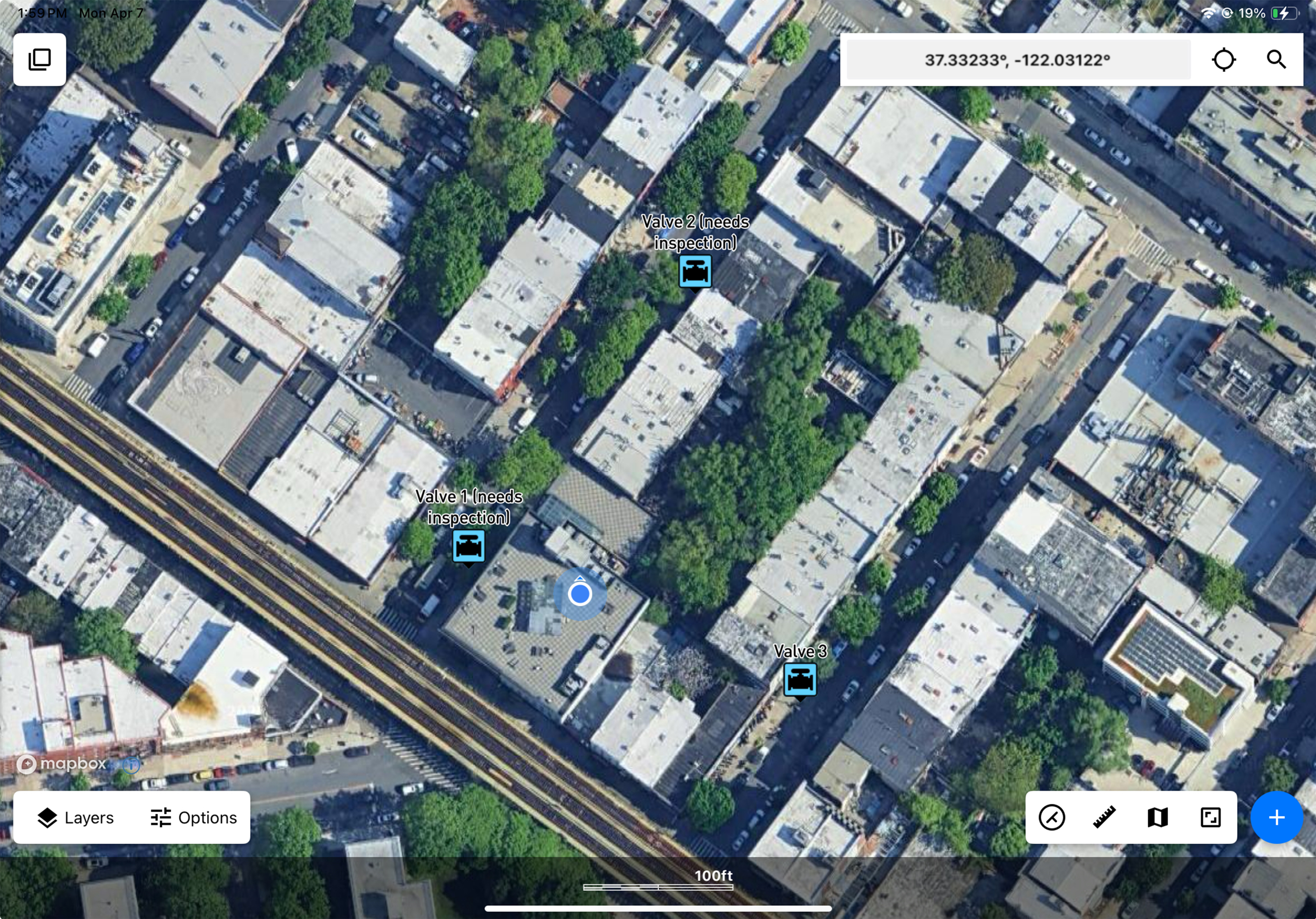 Pictured are some point locations in the Touch GIS mobile GIS application with the user's location highlighted by a blue puck, showing how it can help orient you to a specific location.