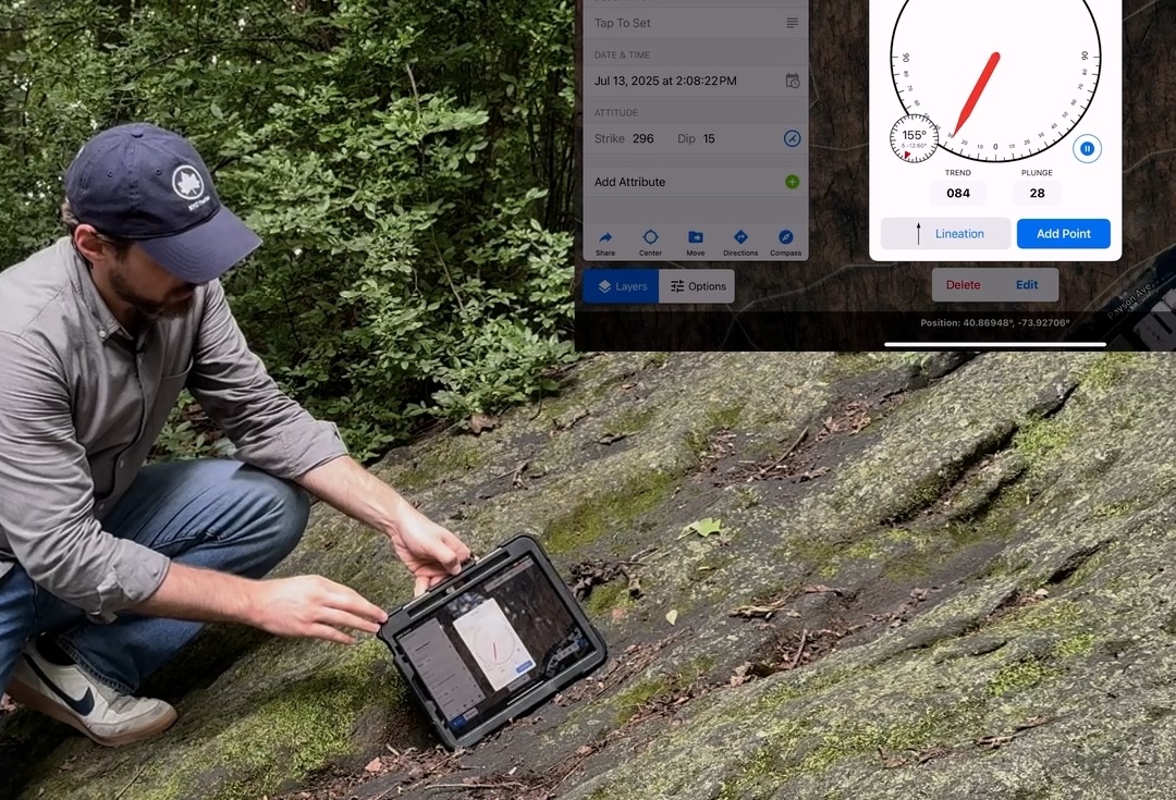 A man holds an iPad up to a line-like crack in a rock, demonstrating how to measure the crack's orientation with the Touch GIS app.
