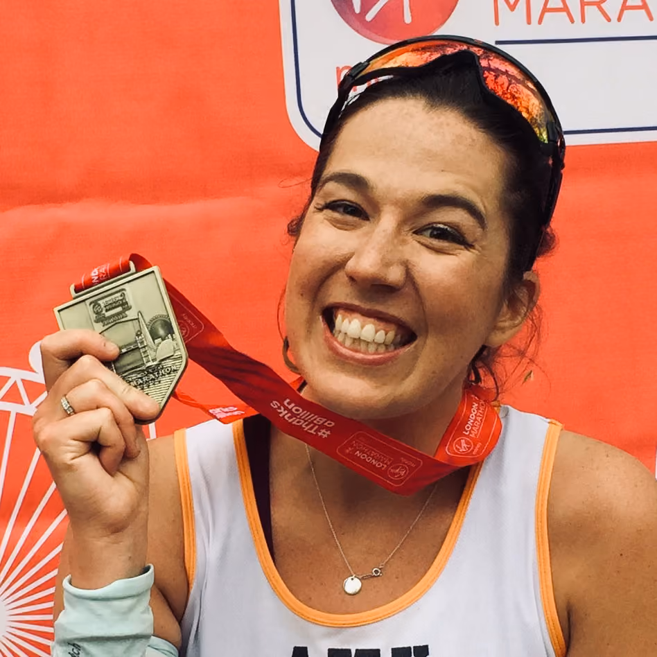 London Marathon runner showing her medal