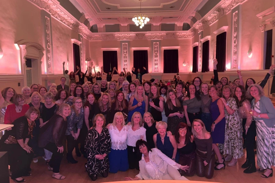 Dining room full of glamorous women