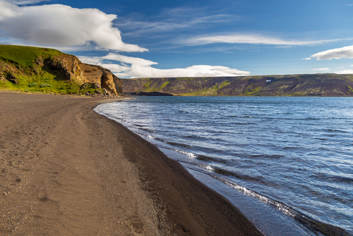Volcanic beach on Lake Kleifarvatn, western Iceland. Beautiful landscape with mountains. Reykjanesfolkvangur Peninsula