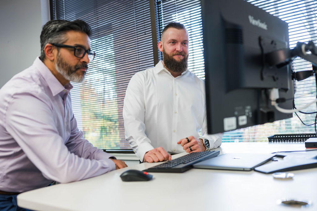 woman sitting at viewsonic computer station