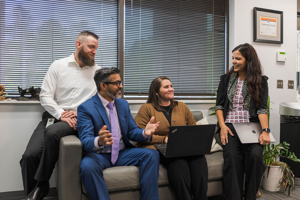 team members at conference table talking