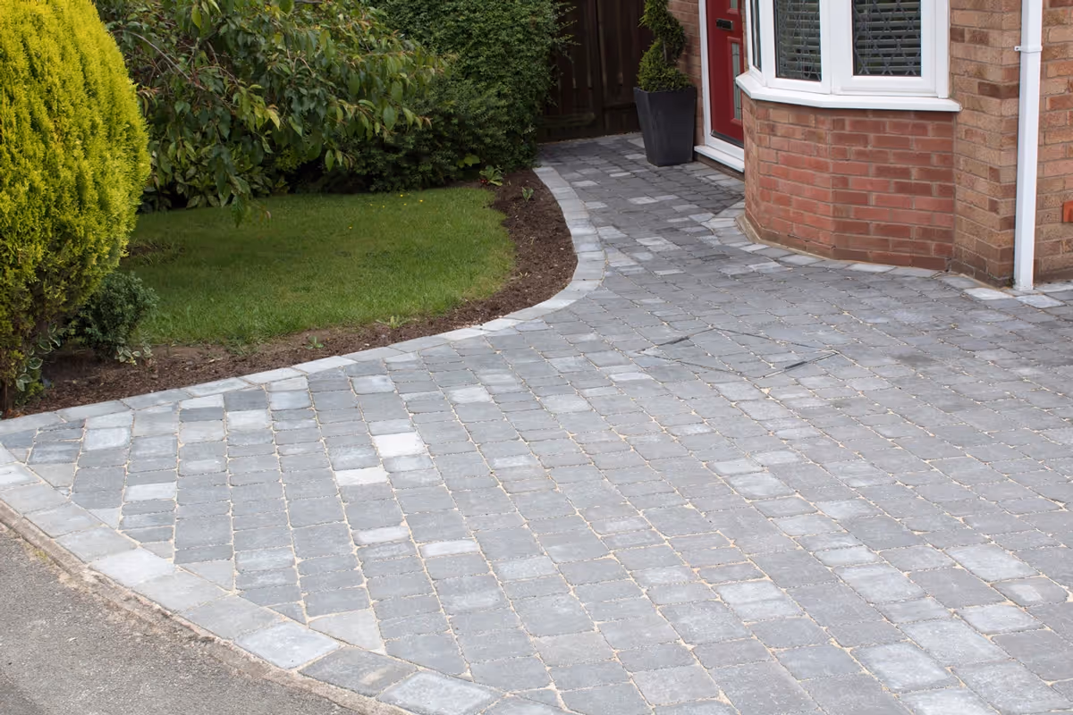 Charcoal Rumbled paving set driveway with Ash border.