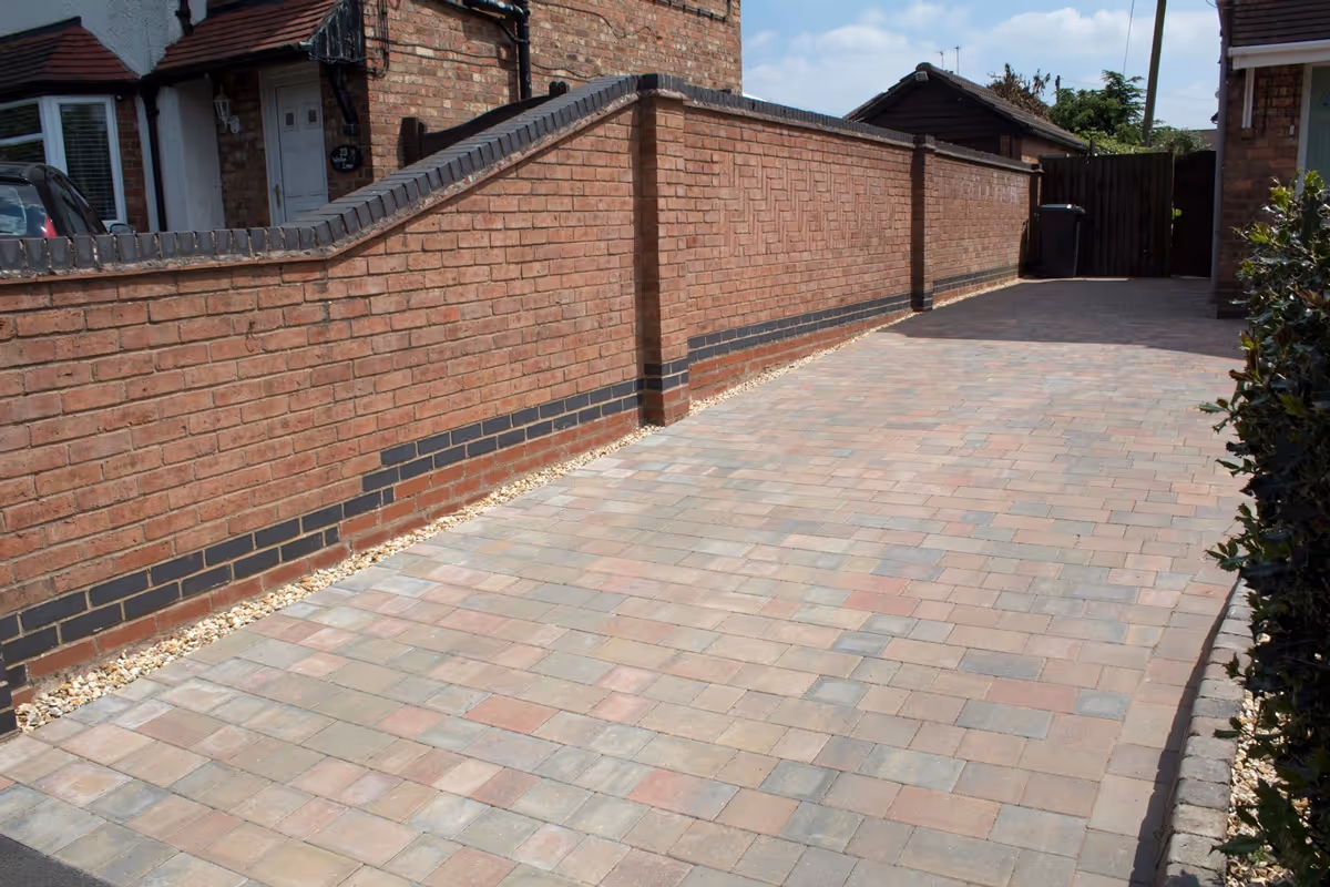 Autumn mix pencil edge driveway with autumn mix K.L kerb sets and a golden gravel area - angle 3