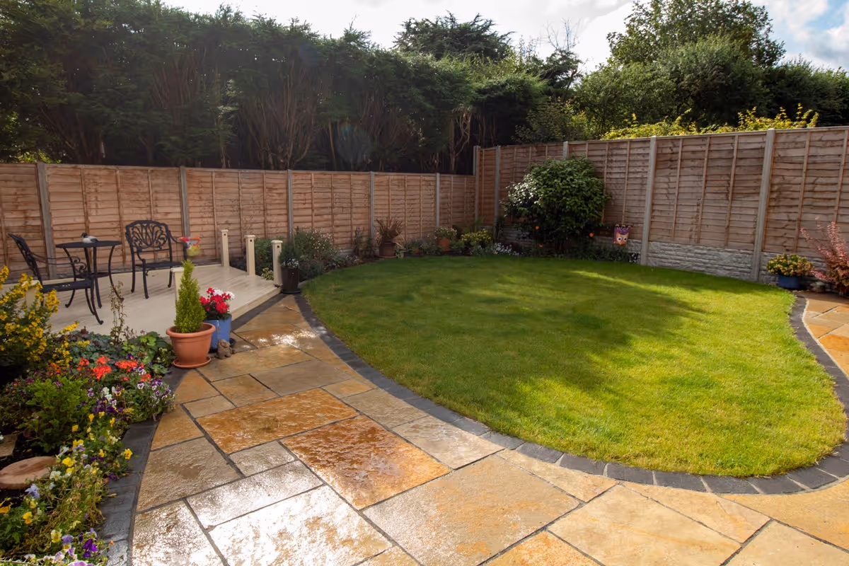 Mixed size yellow limestone patio with large charcoal rumbled block.  - angle 6