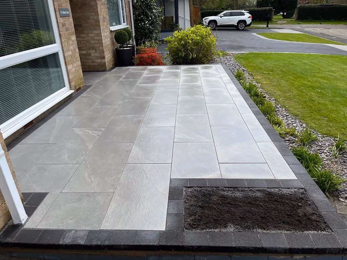 Earthcore Grey porcelain patio with charcoal pencil edge paving - angle 2