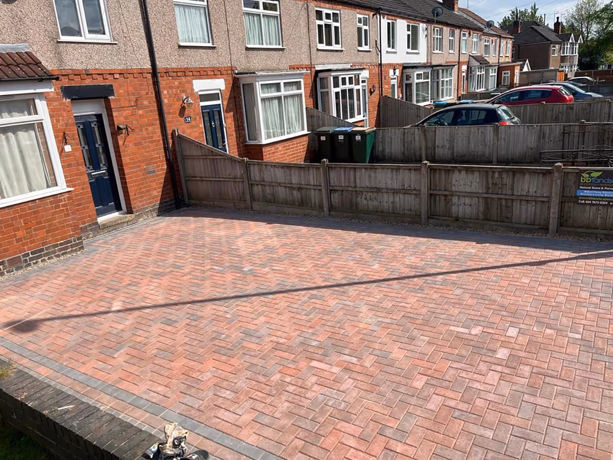 Standard brindle block paving driveway. Triple border with standard charcoal blocks - angle 3