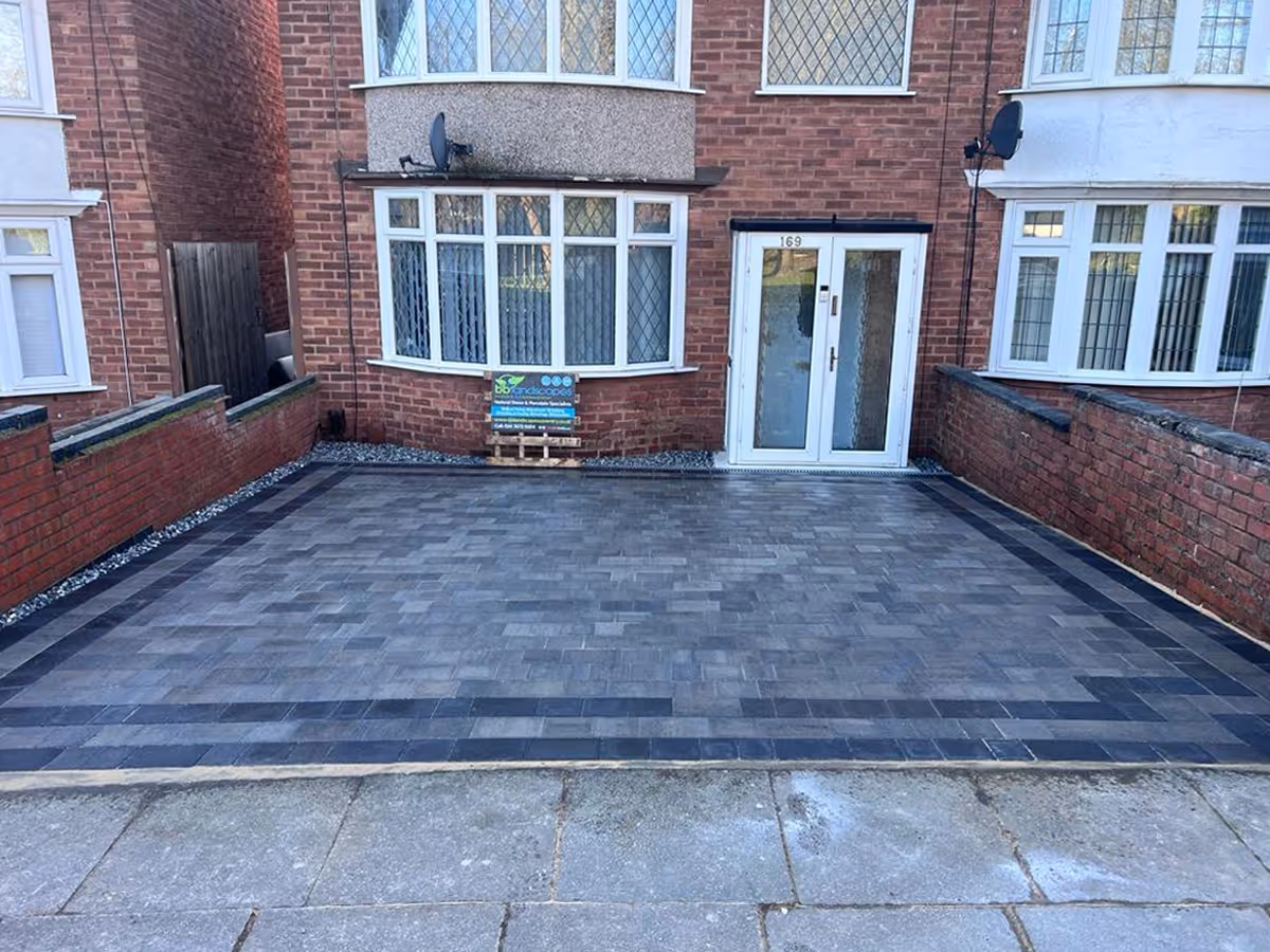 Silver grey pencil edge mixed-size paving. Triple border using charcoal pencil edge paving. ACO drainage system - angle 3