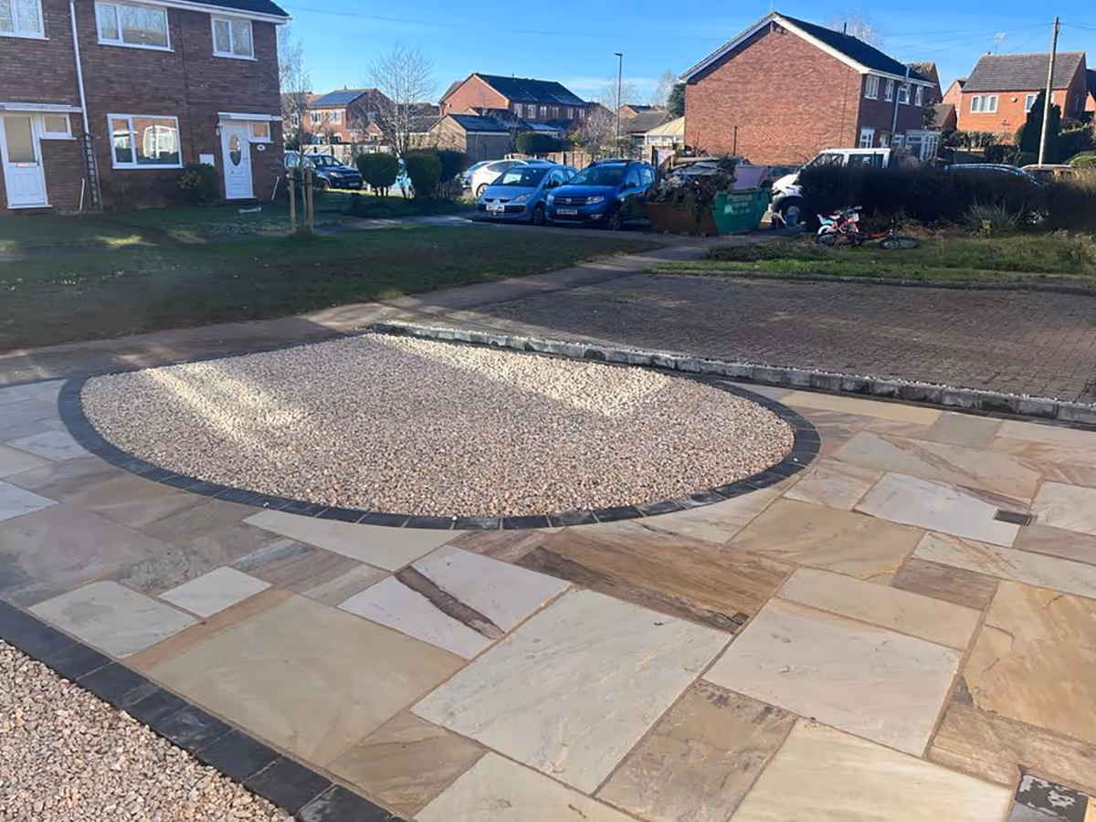 Mixed Size Fossil Buff Natural Stone, Cotswold 20mm Chippings, Charcoal Rumbled Borders and Block Edgings.