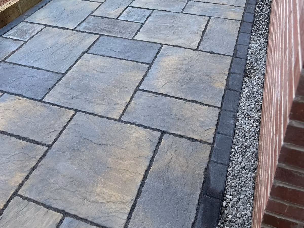 Natural stone patio with charcoal pencil edge paving - angle 2