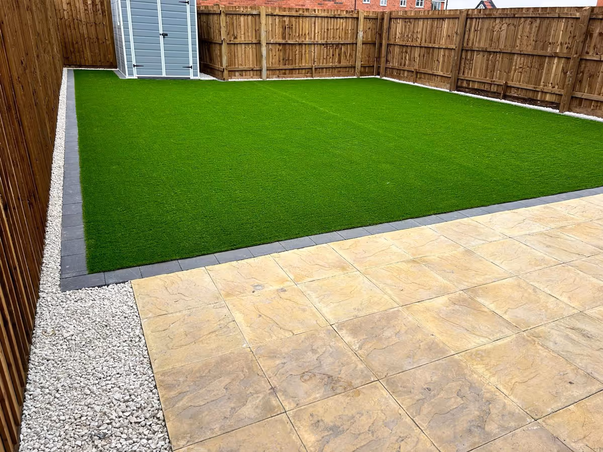 Natural stone patio and artificial grass