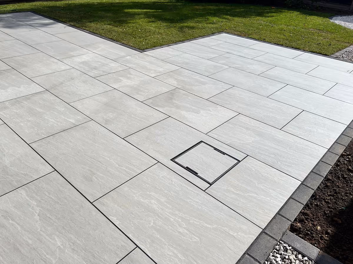 Total Stone Grigio porcelain patio with charcoal pencil edge paving