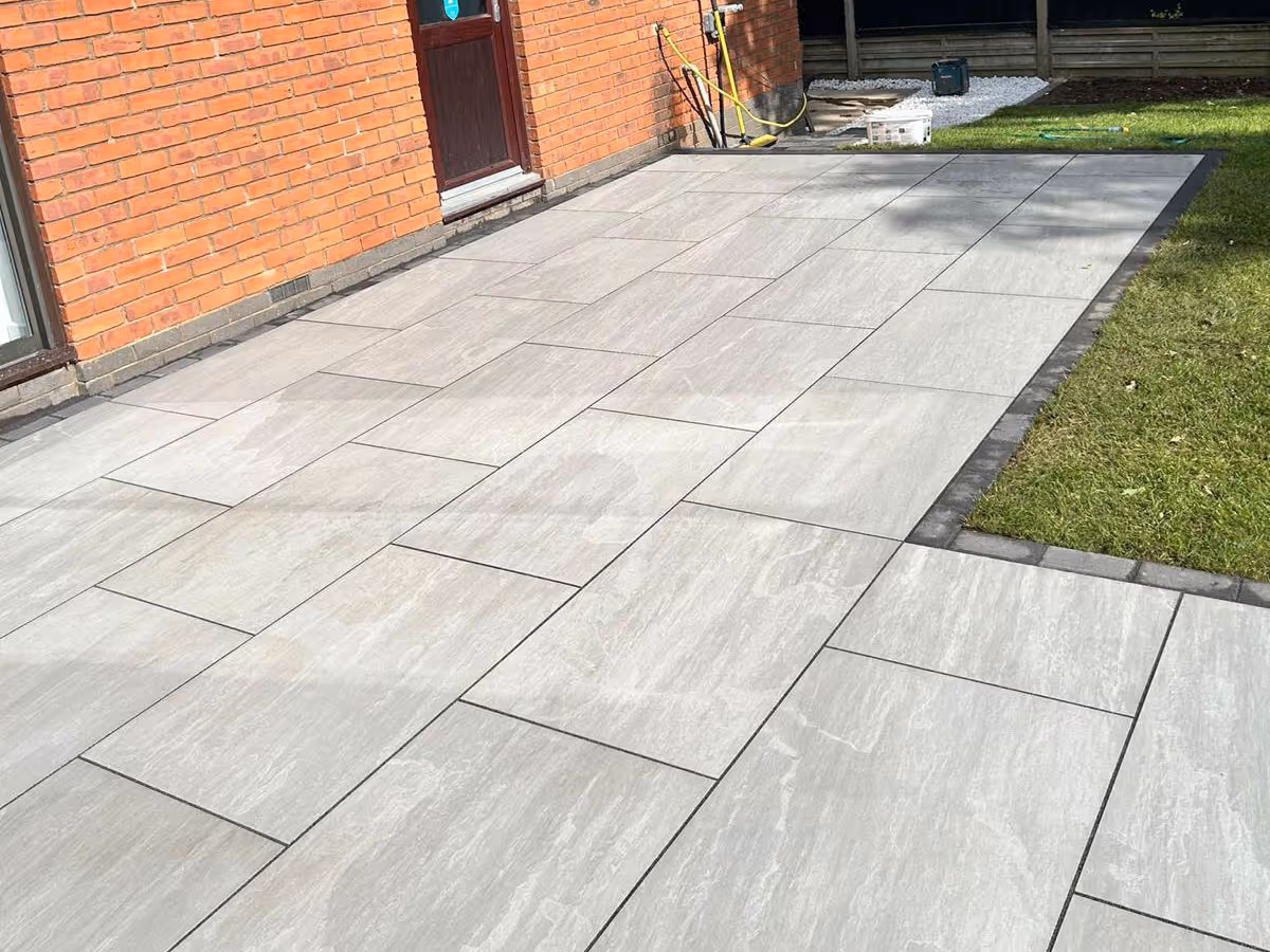 Total Stone Grigio porcelain patio with charcoal pencil edge paving - angle 2