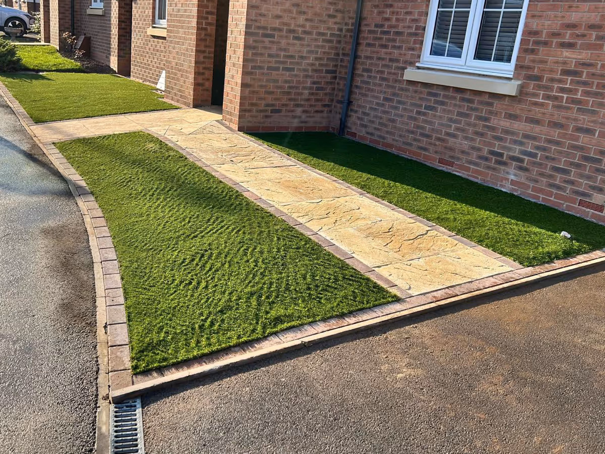 Natural stone path and artificial lawn