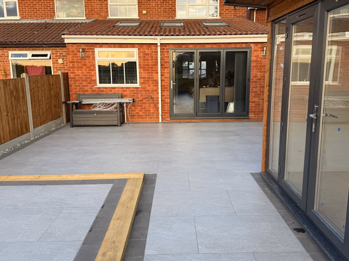 Garden room, porcelain patio with charcoal pencil edge paving and sleepers