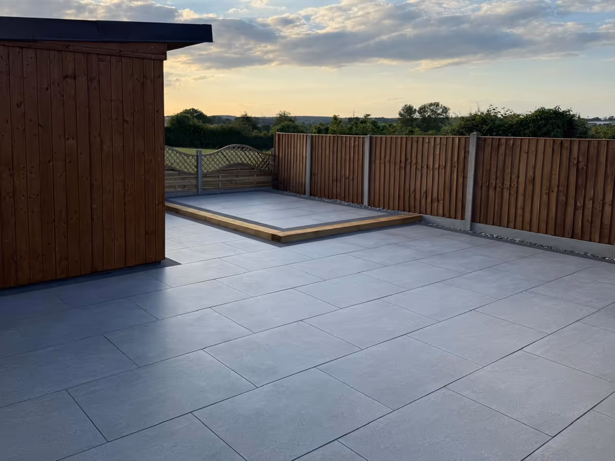 Garden room, porcelain patio with charcoal pencil edge paving and sleepers. - angle 5