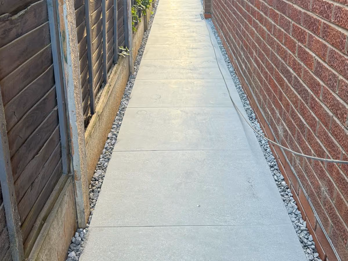 Garden room, porcelain patio with charcoal pencil edge paving and sleepers. - angle 4