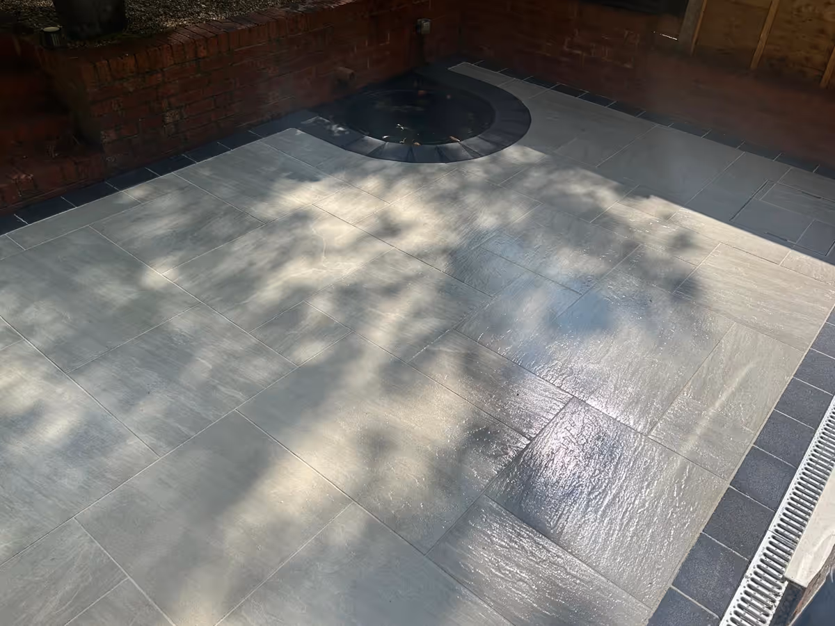 Mixed-size porcelain slabs with charcoal pencil edge paving - angle 4