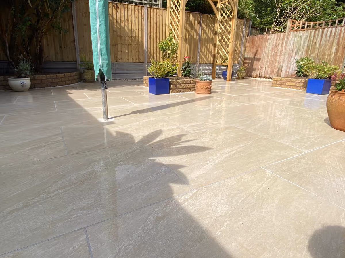 Porcelain patio, pencil edge paving and lawn