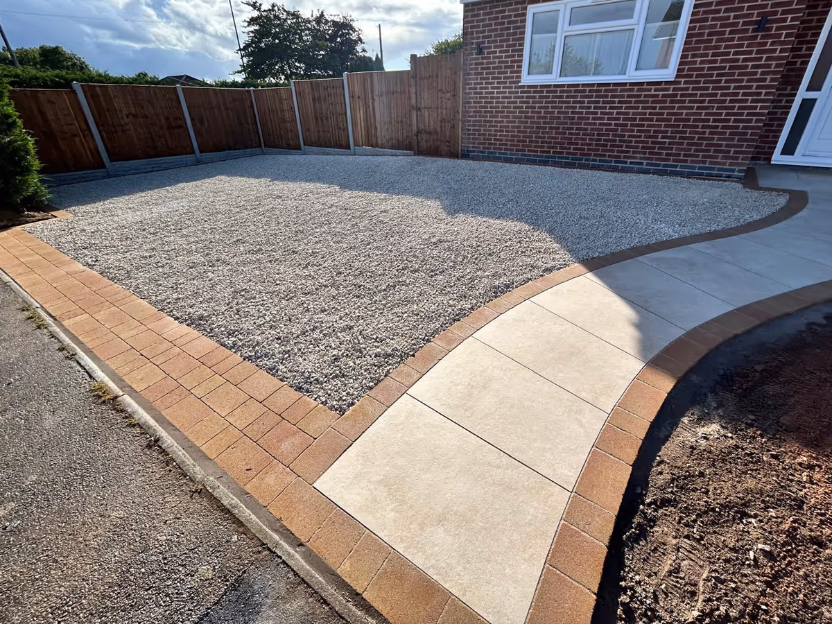 Gravel a natural stone driveway with block paved edges