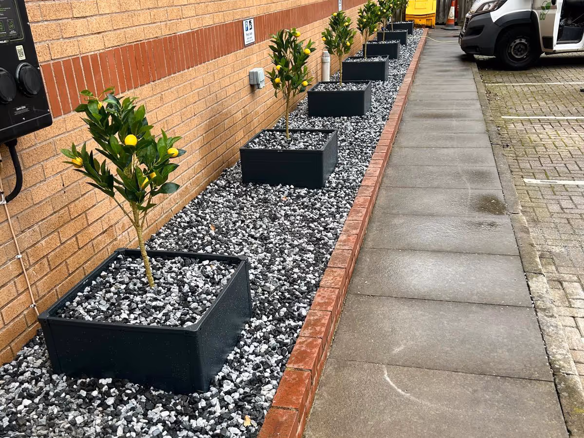 Gravel boarder with block edge and planters - angle 1