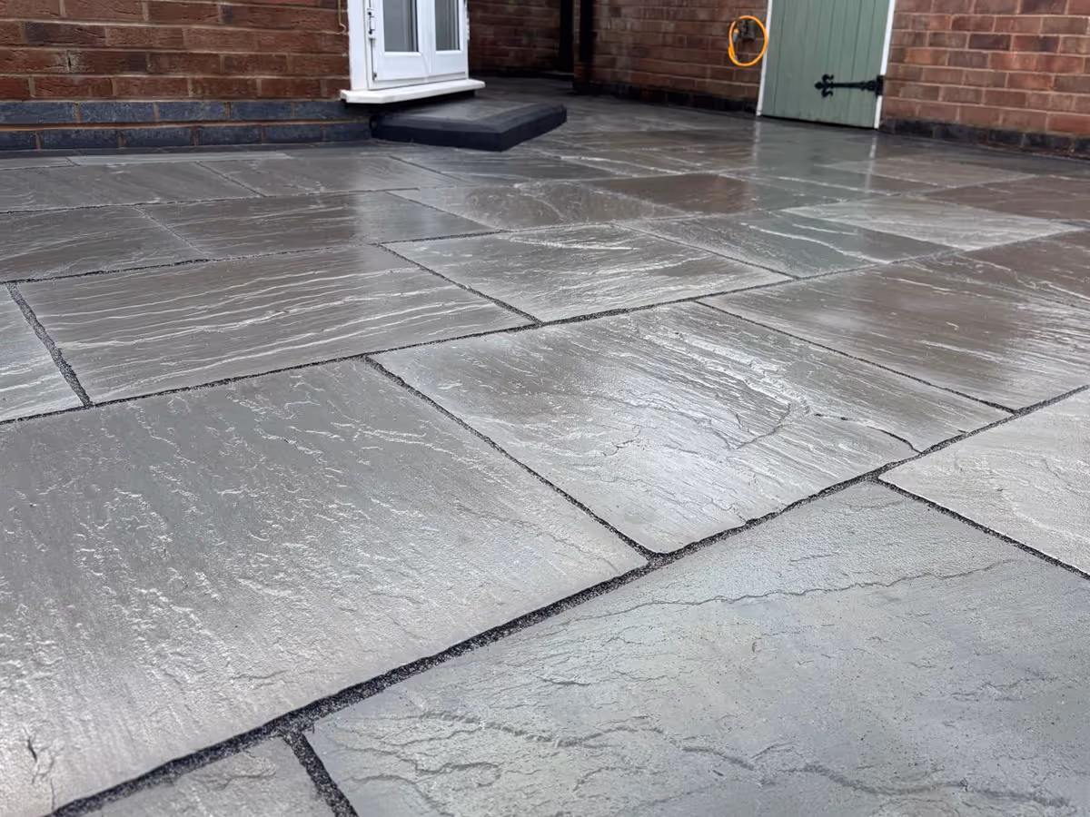 Total Stone Grigio porcelain patio with charcoal pencil edge paving.  - angle 6