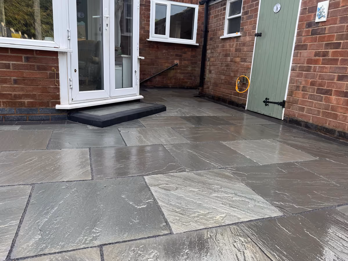 Total Stone Grigio porcelain patio with charcoal pencil edge paving.  - angle 4