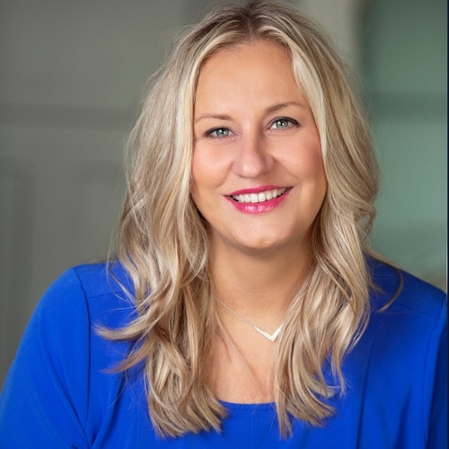 Sara smiling and ready to help care for your skin