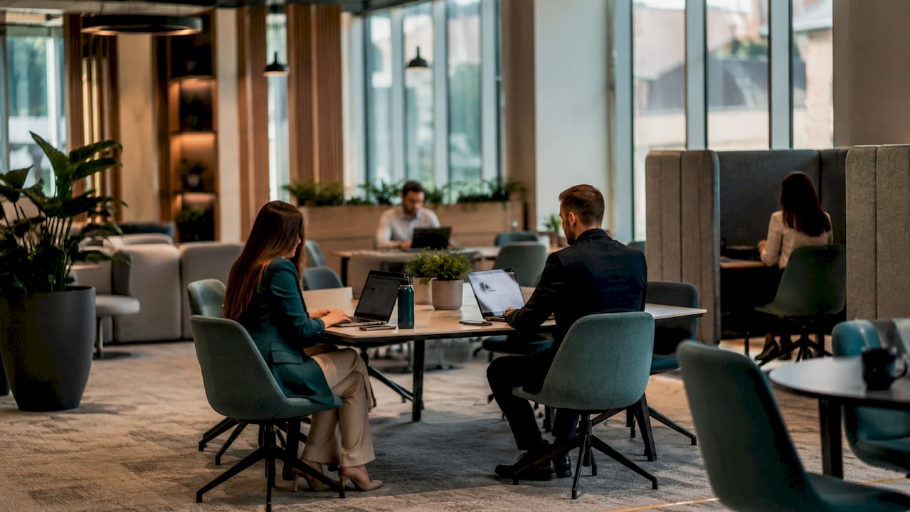 Activity-Based Working zone with office furniture and natural light