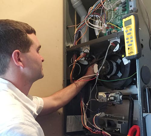 Technician talking to customer about ac