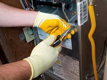 technician working on indoor ac unit