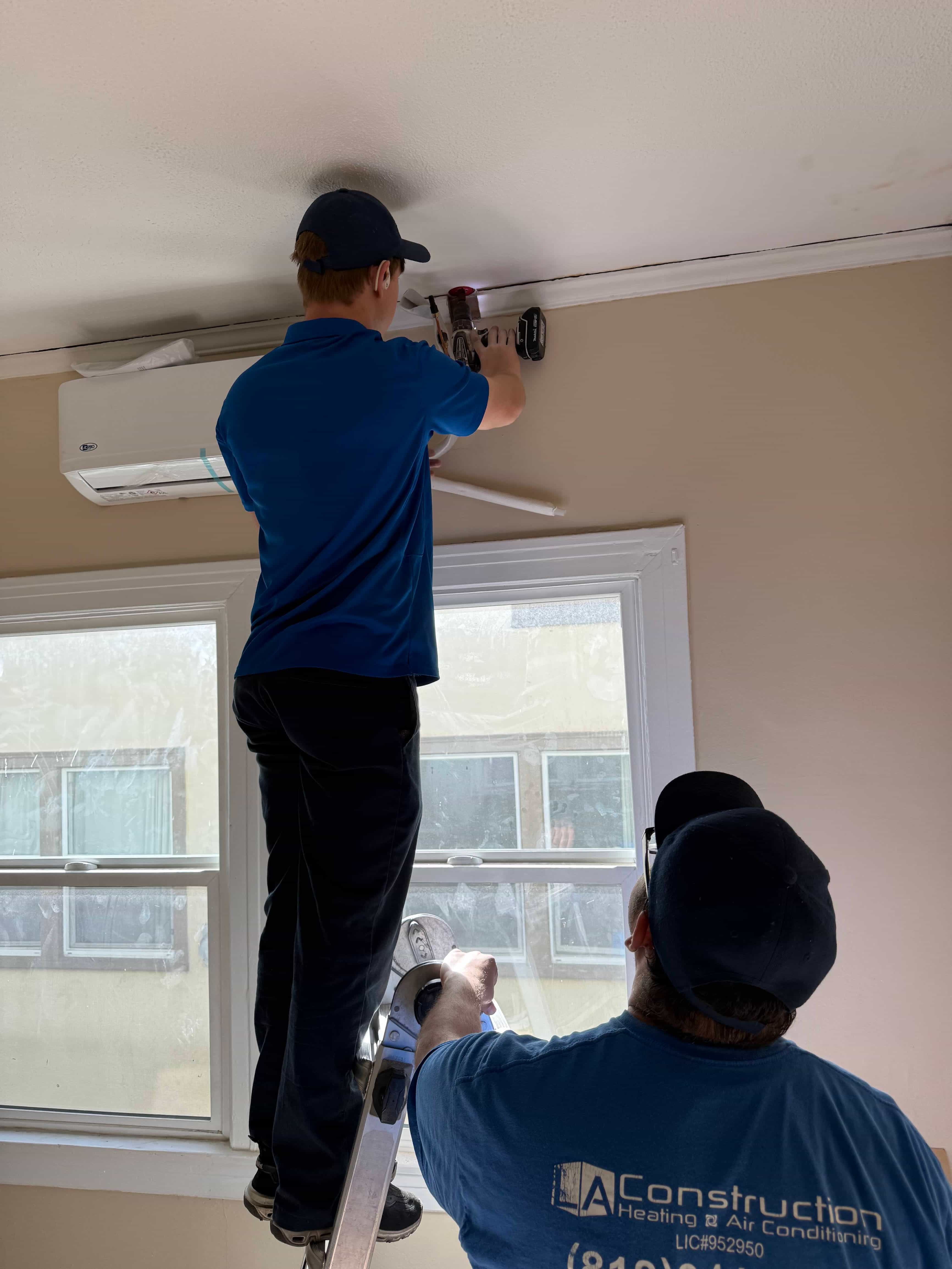 Technician installing hvac system
