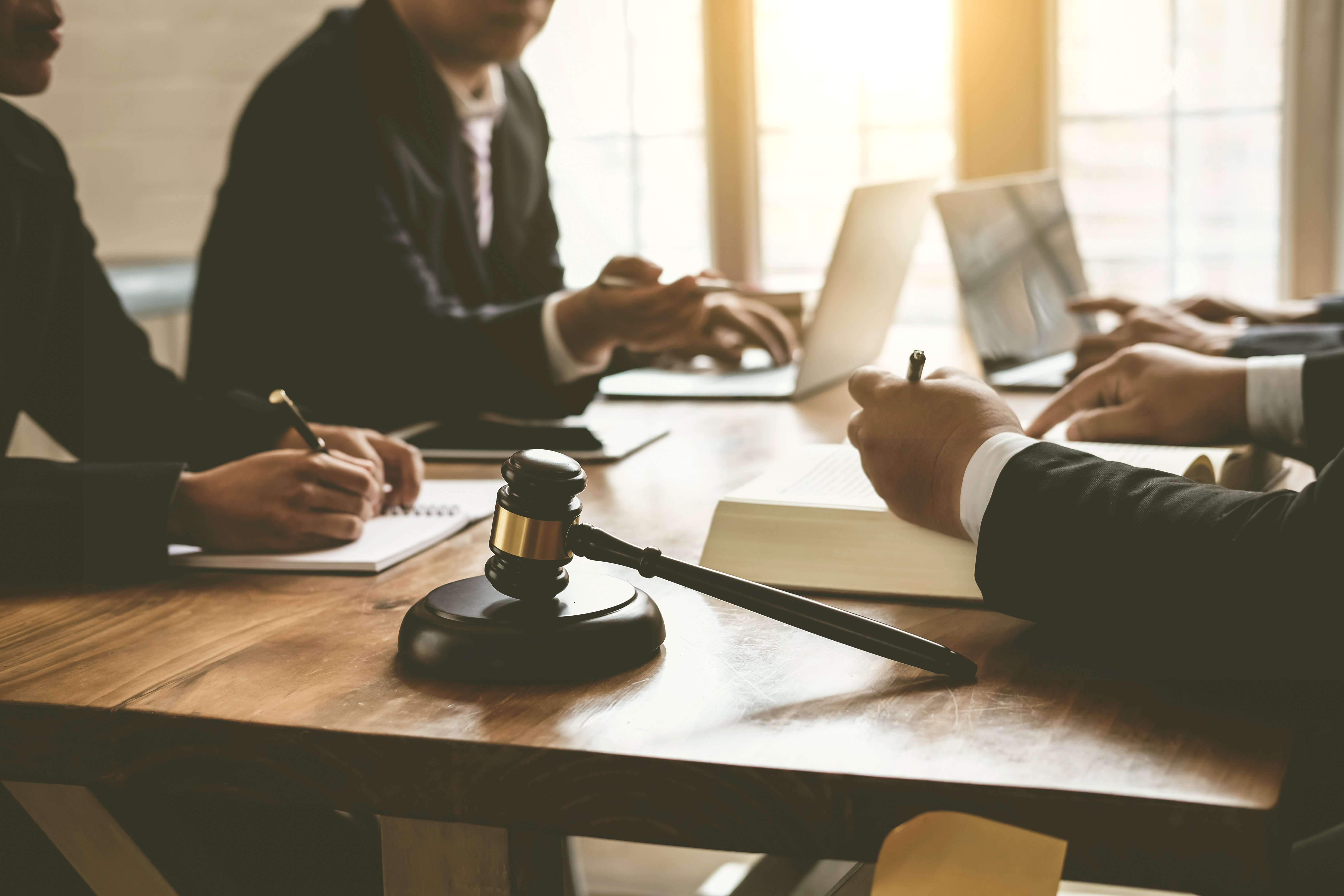 Stock image of lawyers with client at desk