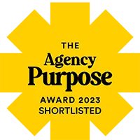 Agency Hackers yellow square flower shaped logo with the wording "The Agency Purpose Awards Shortlisted" written in the middle
