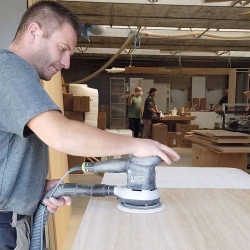 Man using a sanding machine