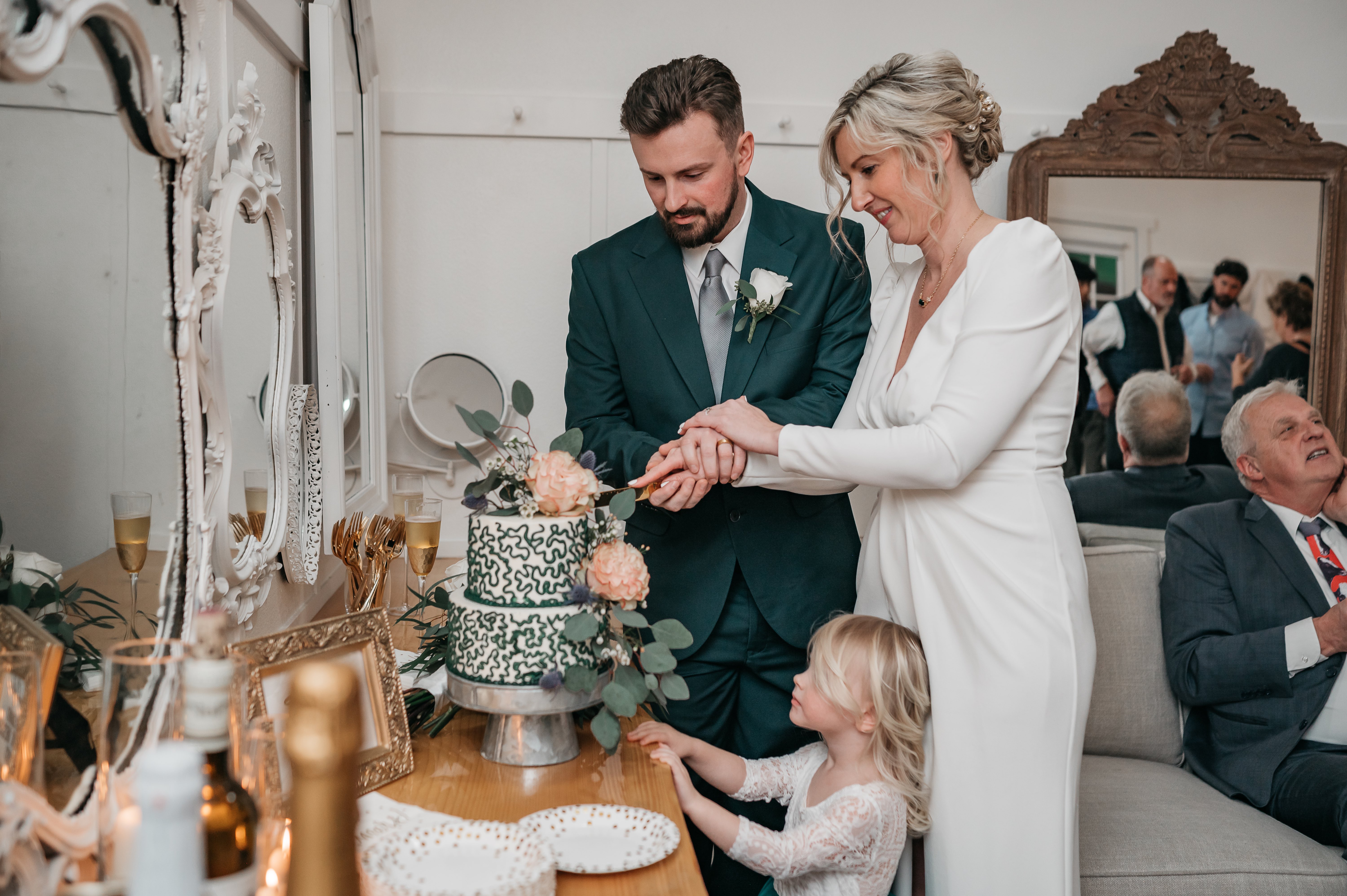 bride and groom cutting cake