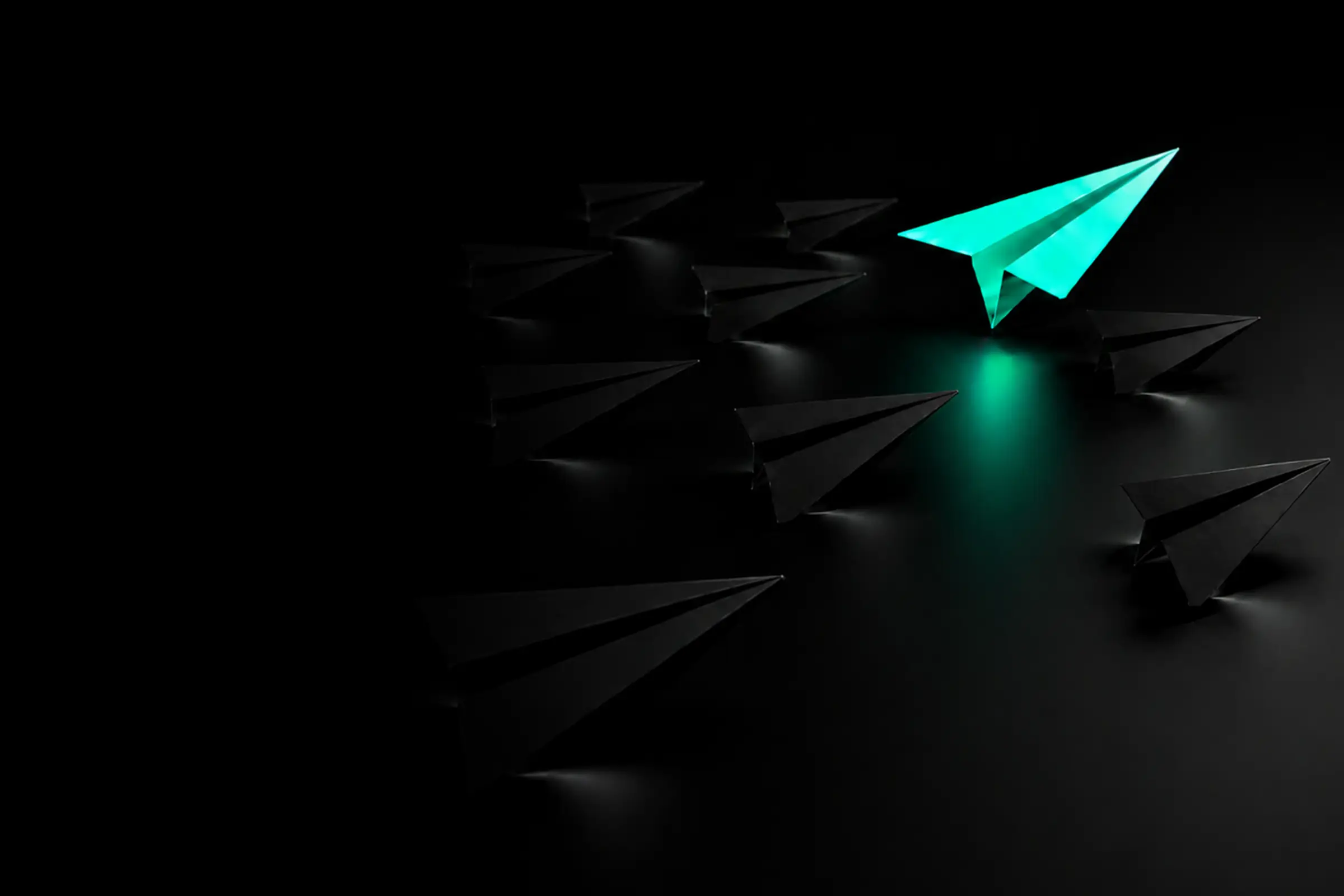Green paper plane standing out among black planes, representing distinctive website design and digital growth.
