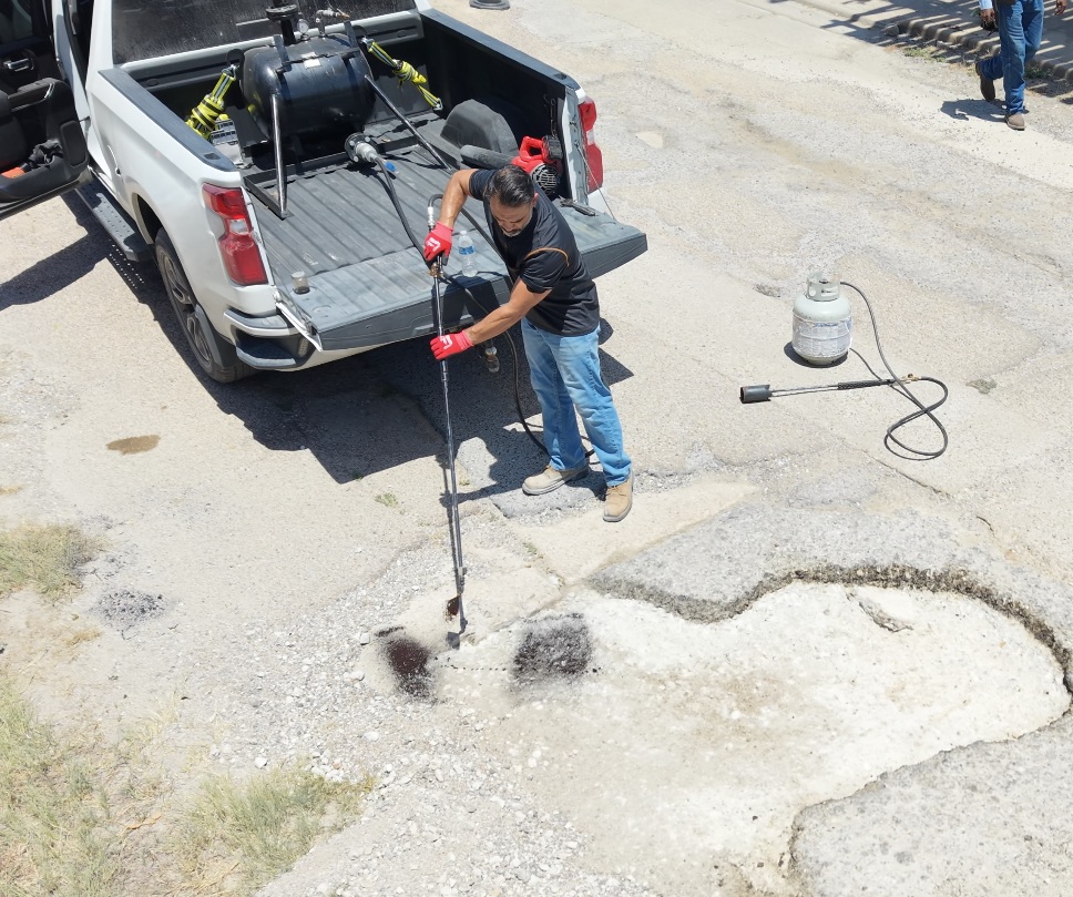 Truck-mounted PCT spray system used for asphalt maintenance